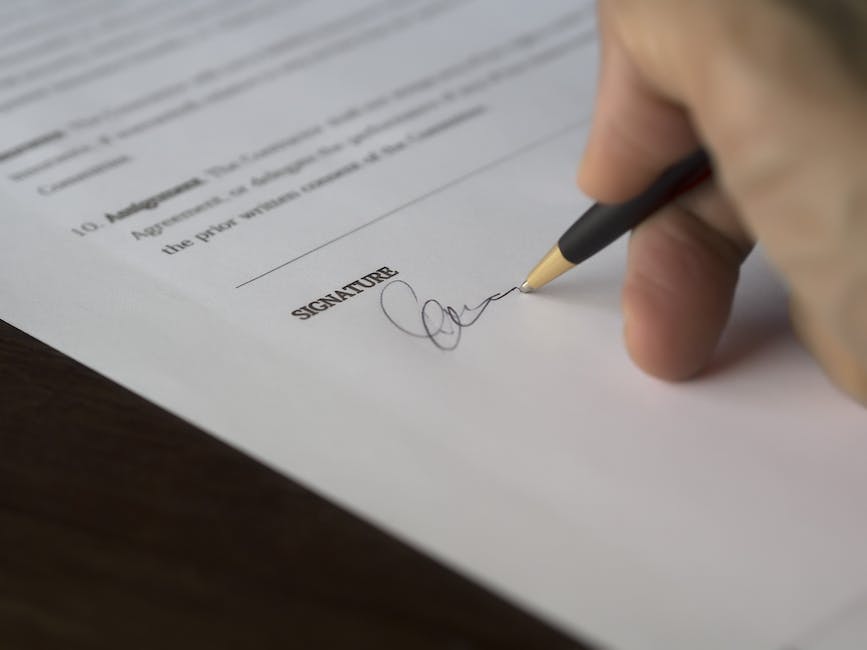 Image depicting a person signing a legal document for estate planning